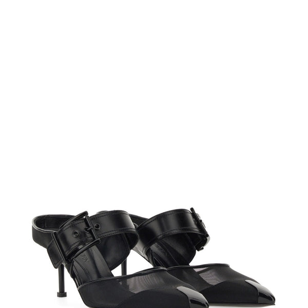 Close-up of Alexander McQueen sandals hardware and fine stitching