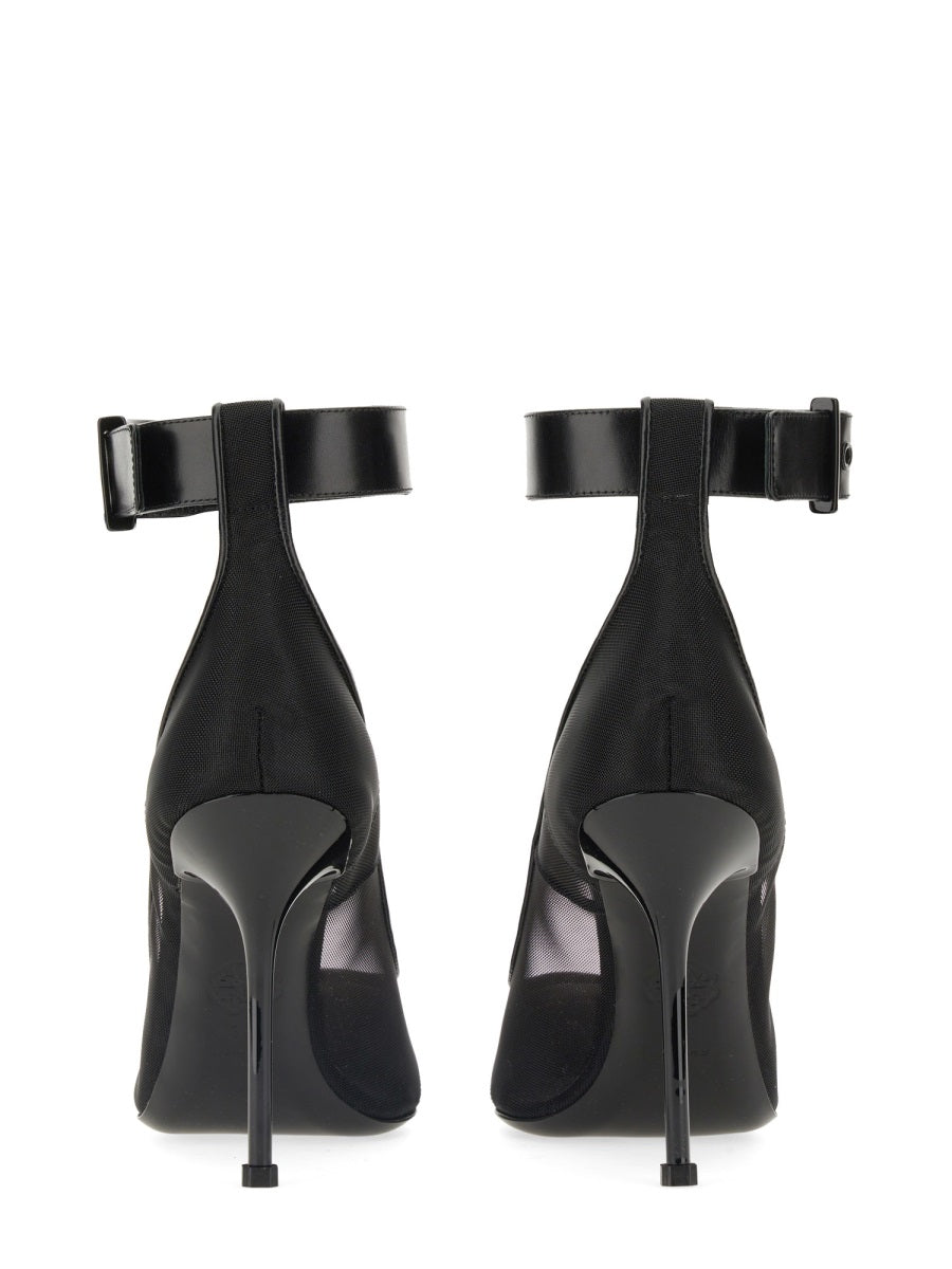 Close-up of Alexander McQueen pumps hardware and fine stitching