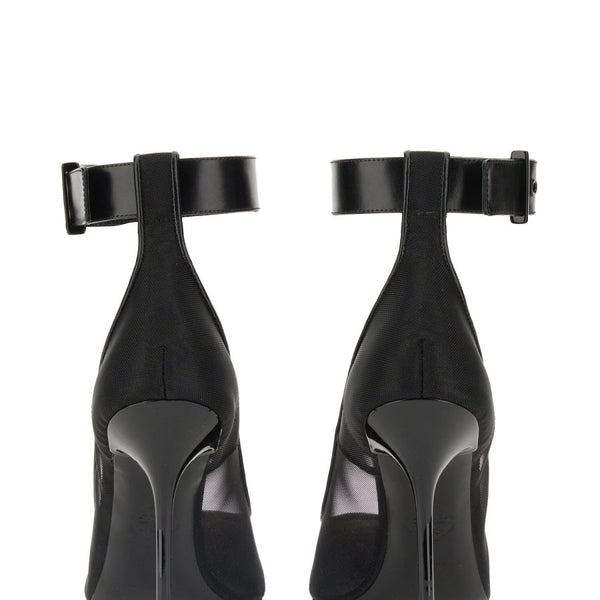 Close-up of Alexander McQueen pumps hardware and fine stitching