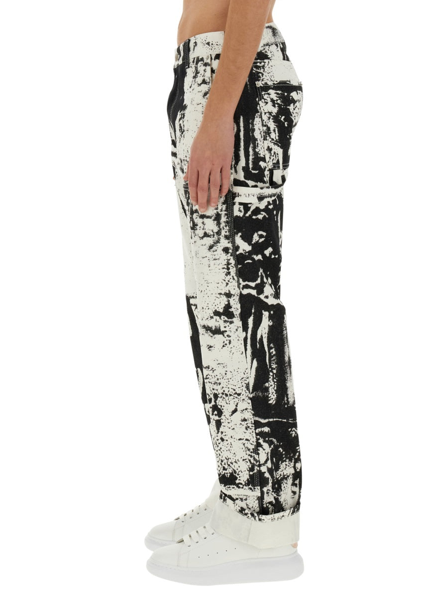 Close-up of Alexander McQueen pants hardware and fine stitching