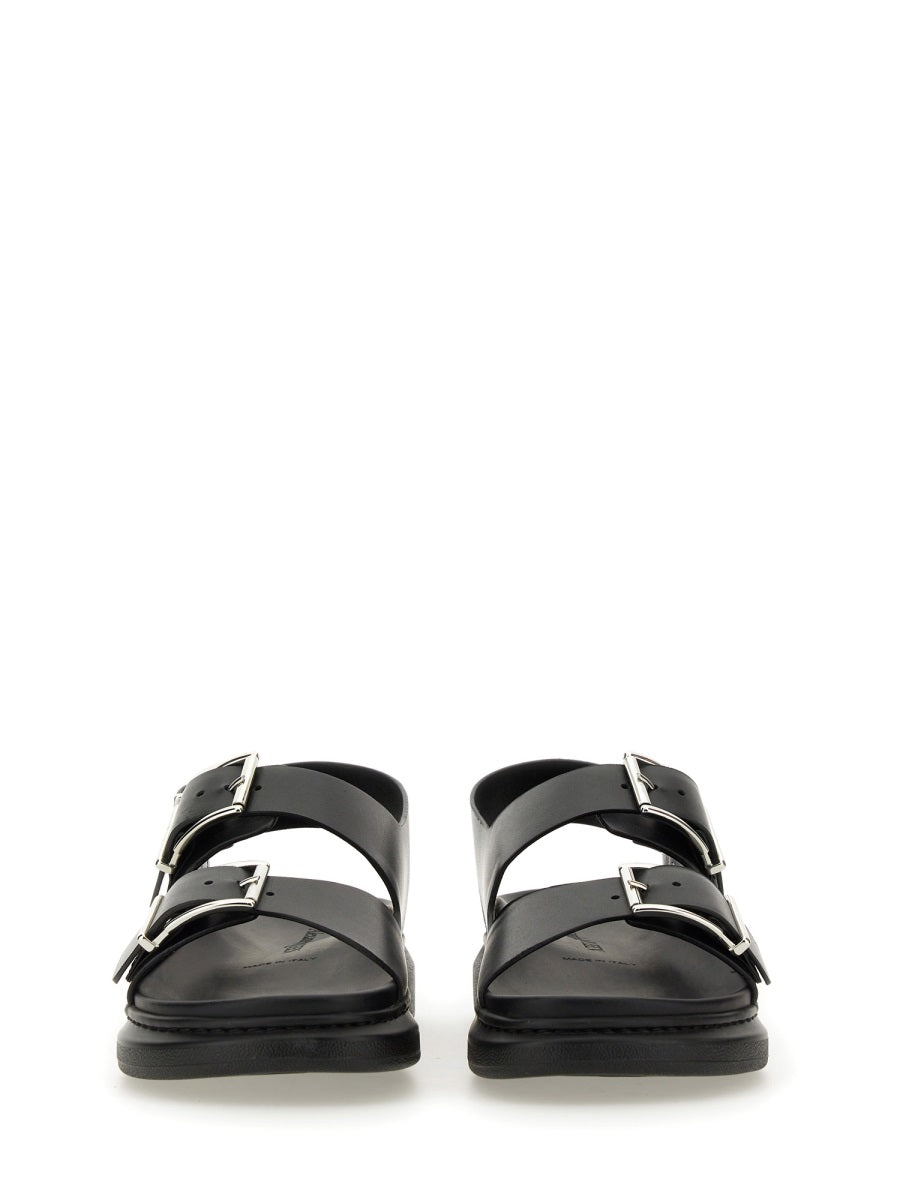 Close-up of Alexander McQueen sandals hardware and fine stitching