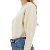 Close-up of Alexander McQueen sweaters & pullovers hardware and fine stitching