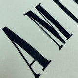 Three-quarter angle view of Amiri luxury piece style No.078