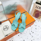 Hermès Beige Slide Sandals - Angled View