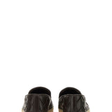 Close-up of Bottega Veneta flats hardware and fine stitching