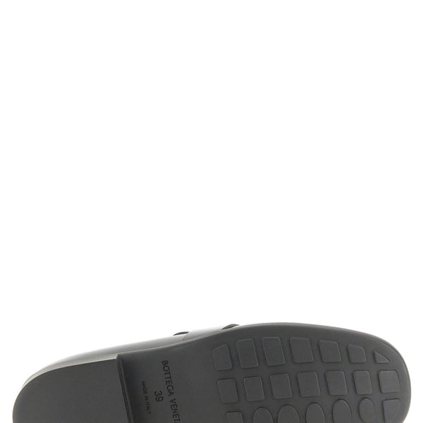 Close-up of Bottega Veneta slides hardware and fine stitching