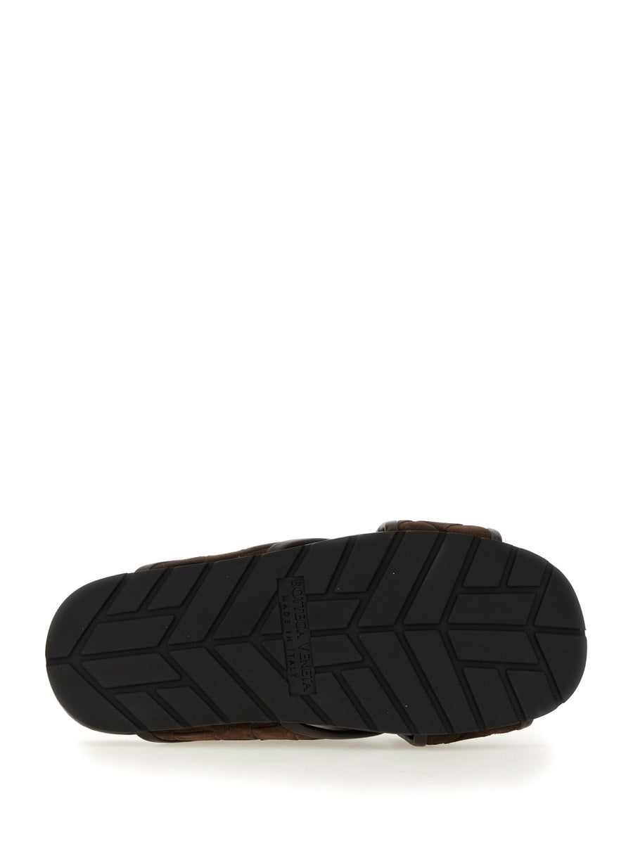 Close-up of Bottega Veneta sandals hardware and fine stitching