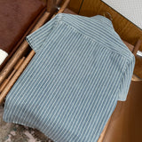 Christian Dior Denim Shirt – luxury designer piece at Velouxe