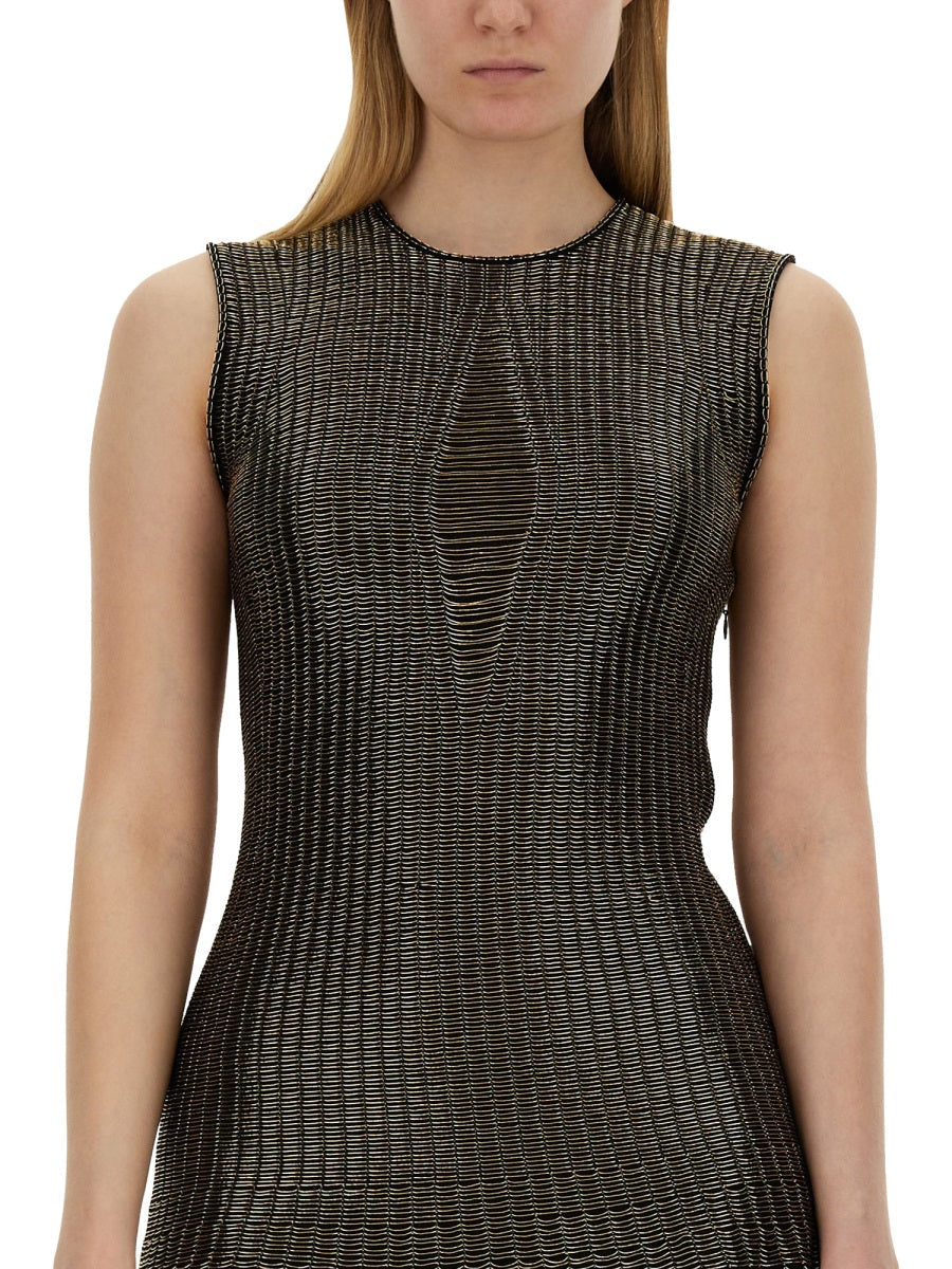 Close-up of Alexander McQueen cocktail dresses hardware and fine stitching