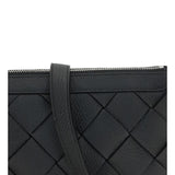 Close-up of Bottega Veneta cross body bags hardware and fine stitching