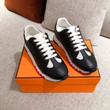 Hermès White High-Top Sneakers - Angled View