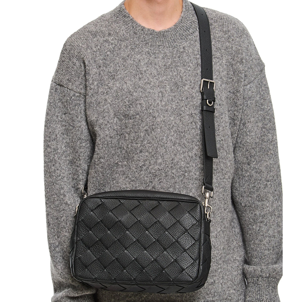 Close-up of Bottega Veneta cross body bags hardware and fine stitching