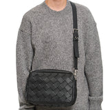 Close-up of Bottega Veneta cross body bags hardware and fine stitching