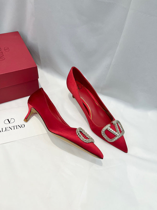 Three-quarter angle view of Valentino Garavani luxury piece style No.216