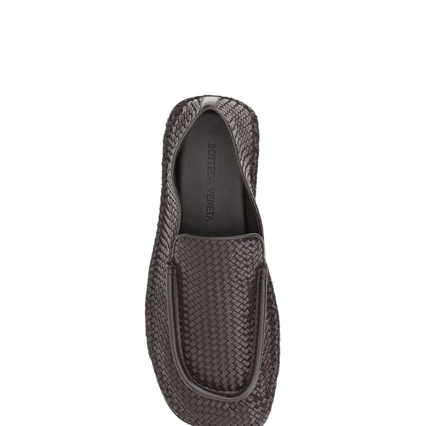Close-up of Bottega Veneta slides hardware and fine stitching
