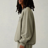 Detail shot of Fear of God Essentials Sweatshirt premium leather texture