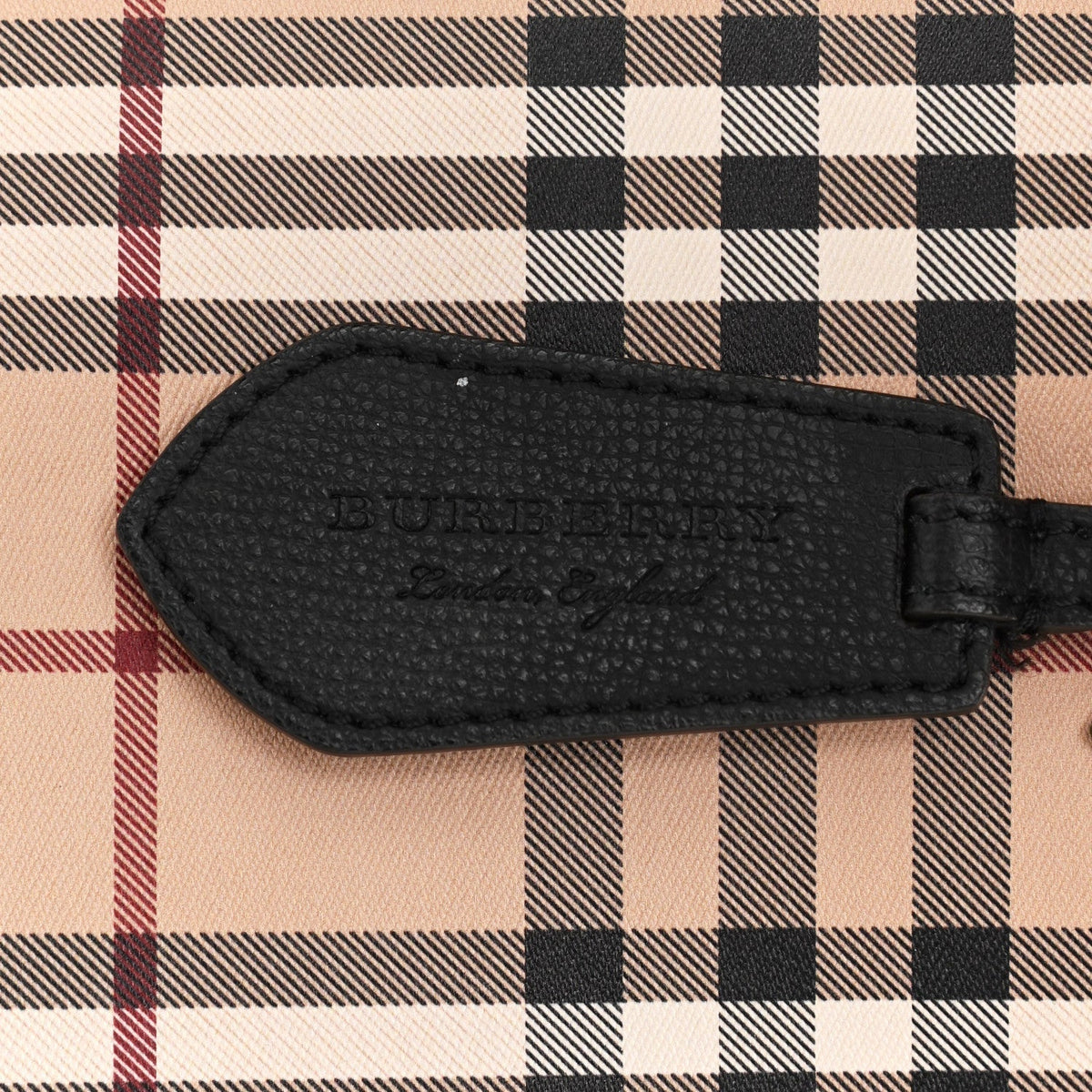Close-up of Burberry shoulder bags hardware and fine stitching