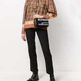 Close-up of Burberry shoulder bags hardware and fine stitching