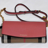 Close-up of Burberry crossbody bags hardware and fine stitching