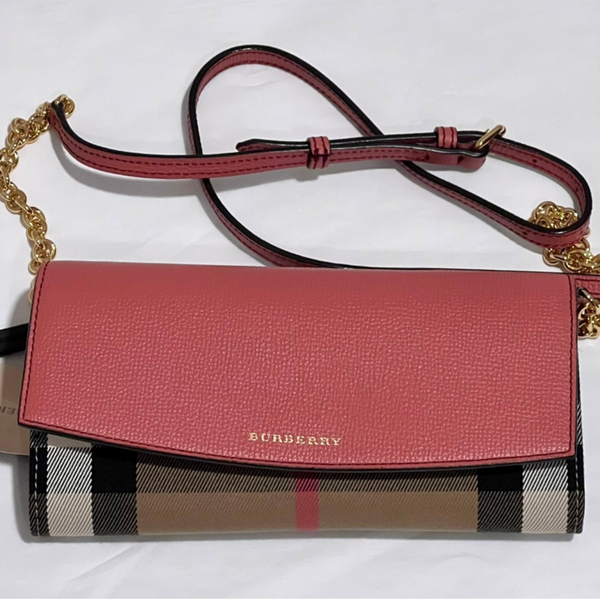 Close-up of Burberry crossbody bags hardware and fine stitching