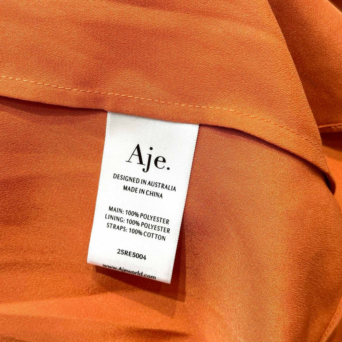 Aje Dress detail shot – authentic designer craftsmanship
