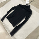 Chanel Turtleneck – luxury designer piece at Velouxe