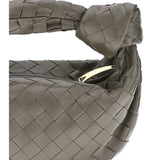Close-up of Bottega Veneta shoulder bags hardware and fine stitching