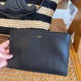 Celine Handbag flat lay on neutral background