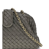 Close-up of Bottega Veneta clutches hardware and fine stitching