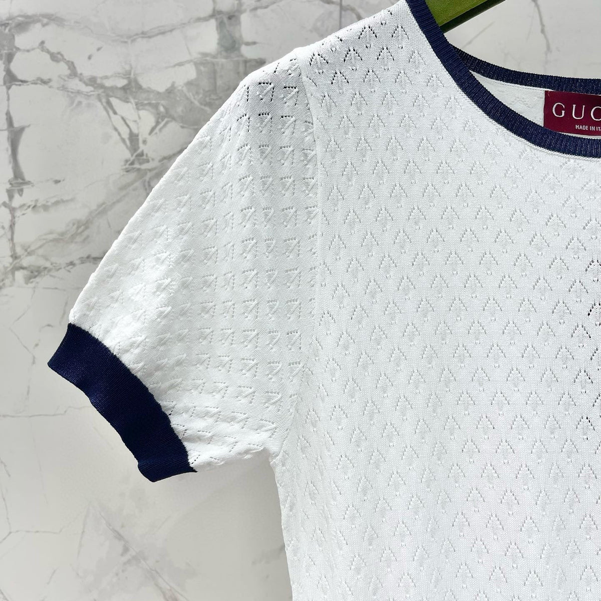 Close-up of Gucci Dress signature hardware and stitching detail