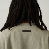 Front view of Fear of God Essentials premium Sweatshirt with iconic logo hardware