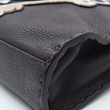 Close-up of Peekaboo bags hardware and fine stitching