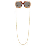 Close-up of Gucci sunglasses hardware and fine stitching