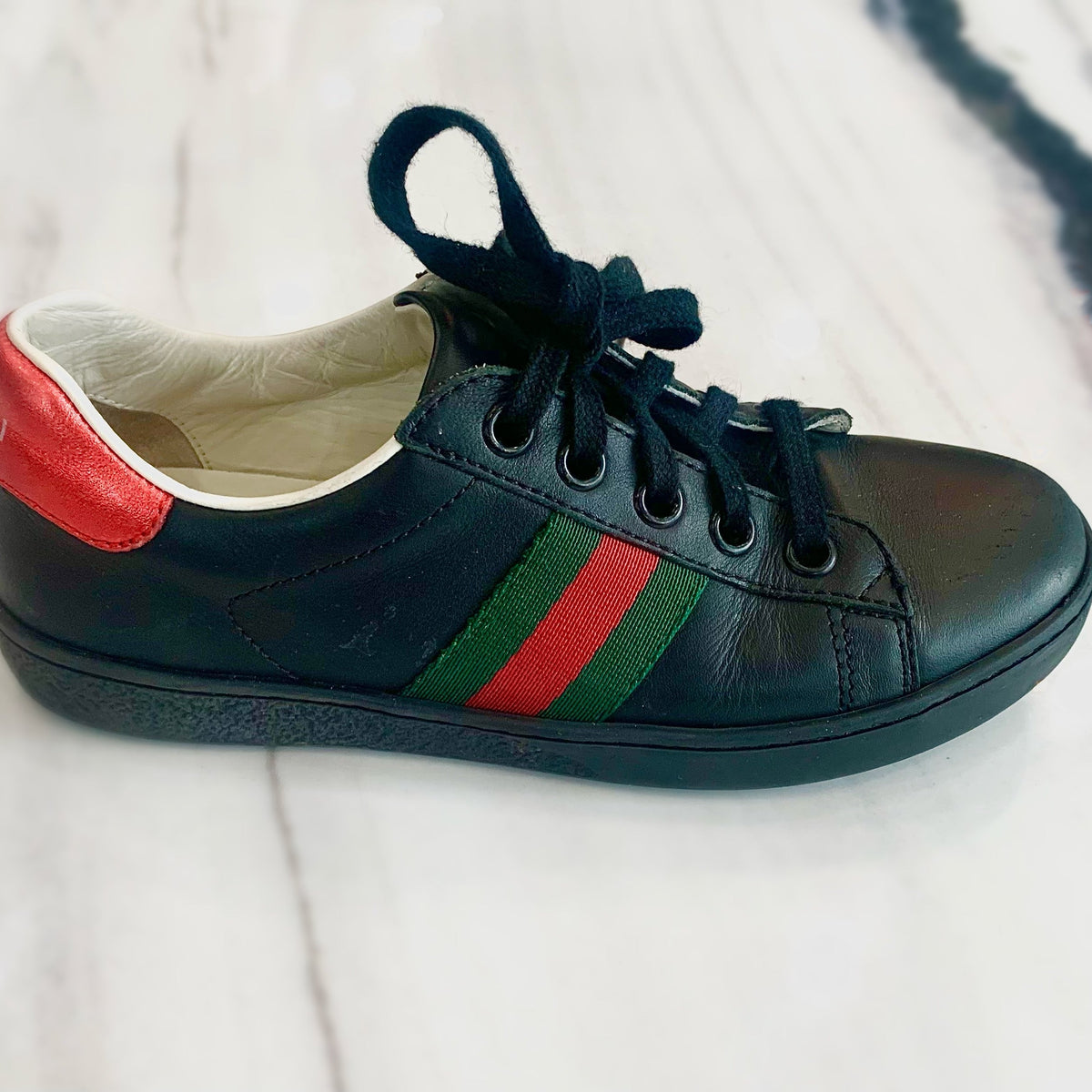 Gucci sneakers lifestyle shot premium designer piece