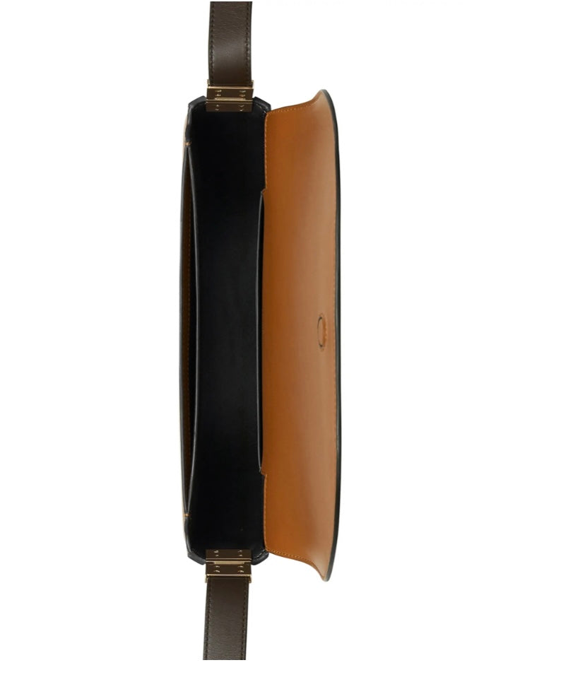 Close-up of Burberry handbags hardware and fine stitching