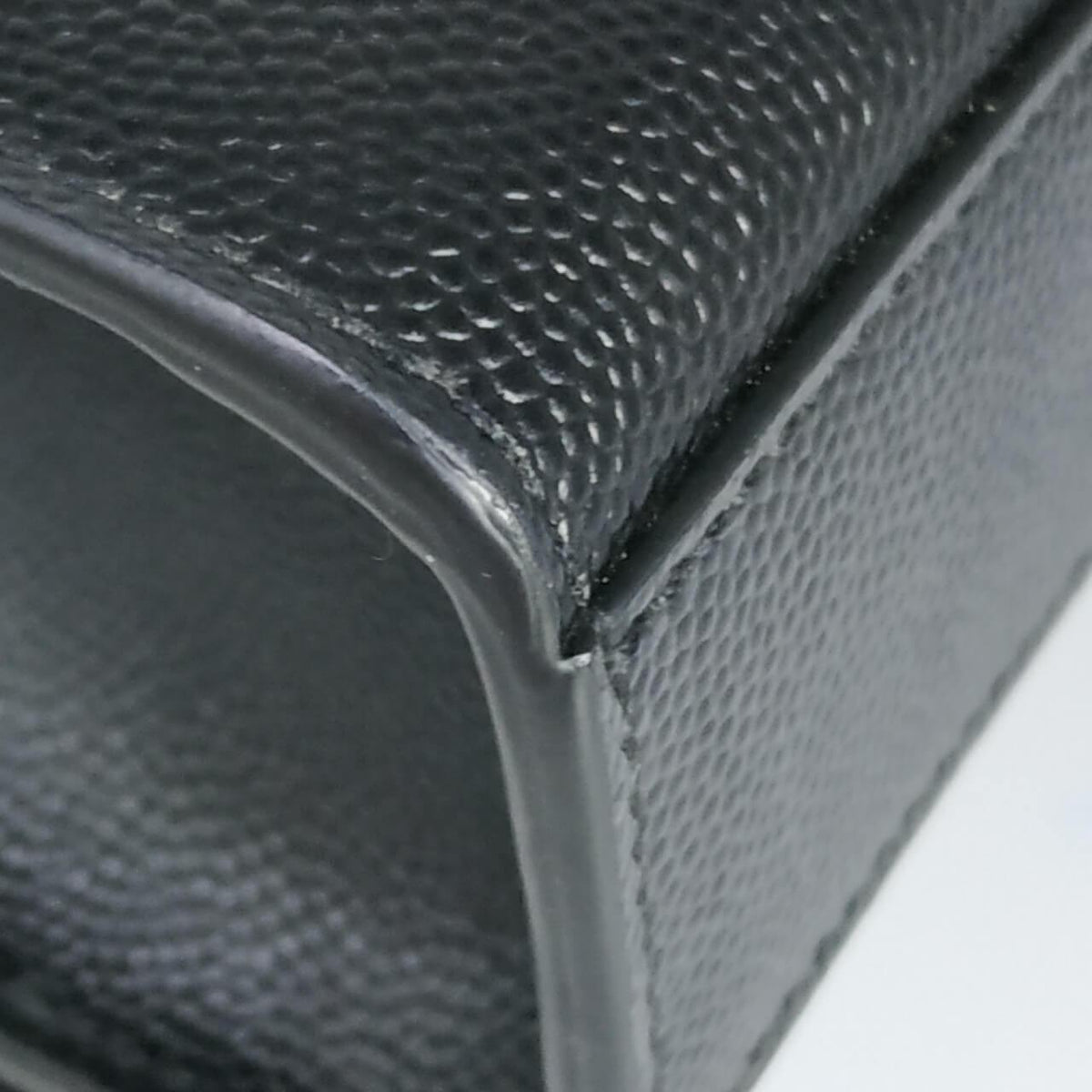 Monogram premium bags detail and craftsmanship close-up