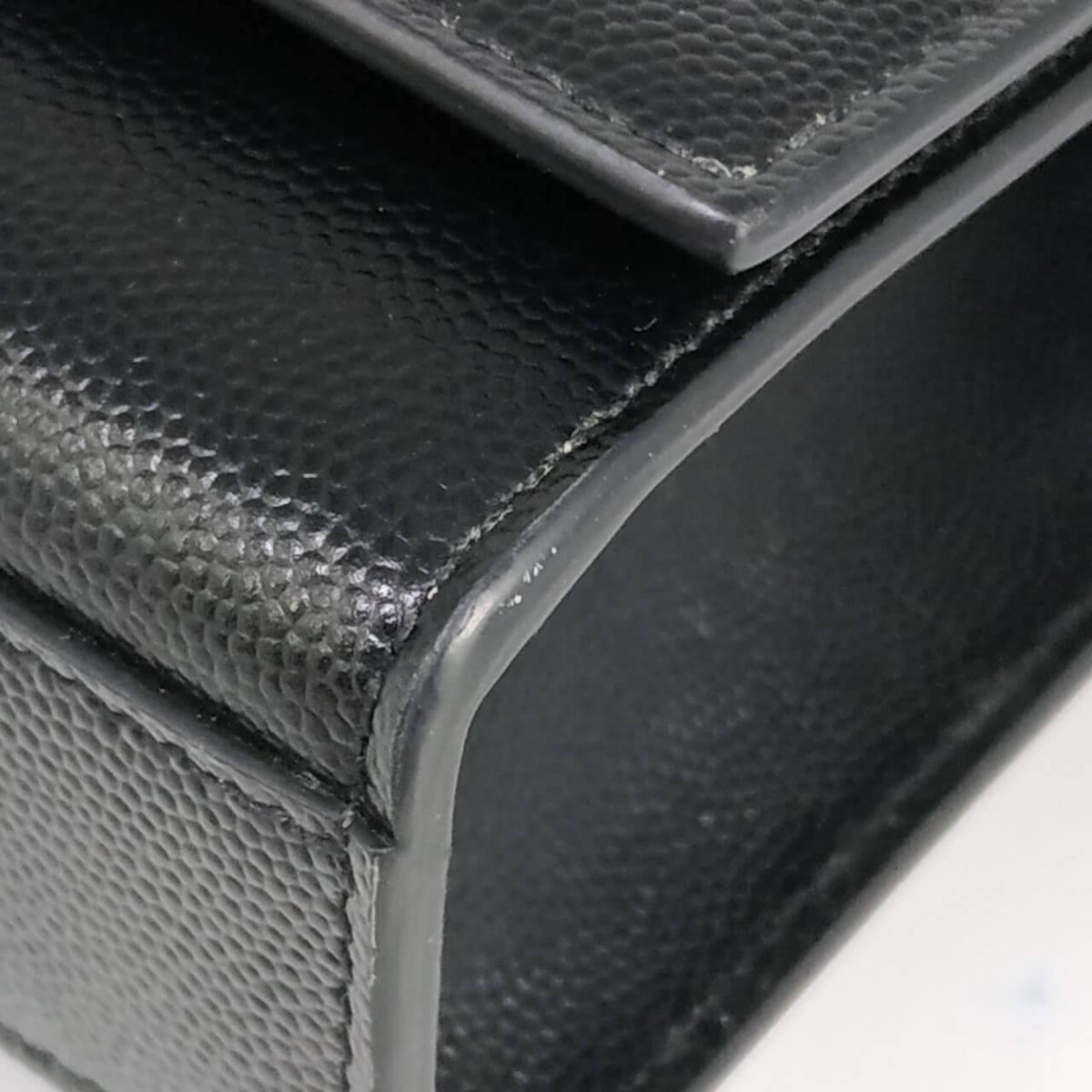 Close-up of Monogram bags hardware and fine stitching