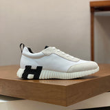 Hermès Black Slide Sandals - Angled View