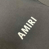 Three-quarter angle view of Amiri luxury piece style No.154