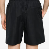 Close-up of Fendi pants hardware and fine stitching