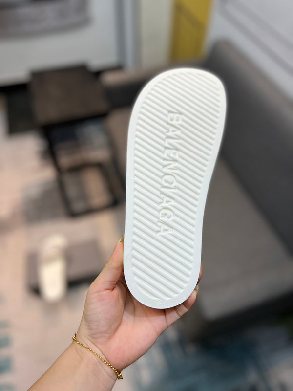 Balenciaga Black Flat Thong Sandals - Angled View
