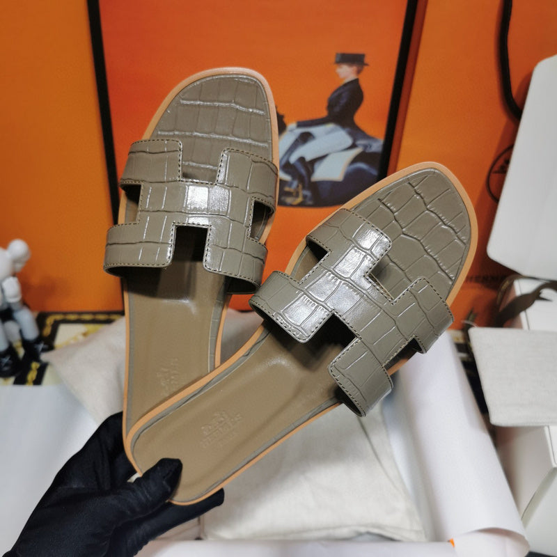 Hermès Nude Block Heel Sandals - Angled View