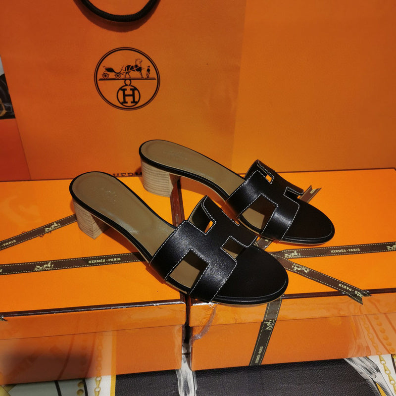 Hermès Black Ankle Strap Sandals - Angled View