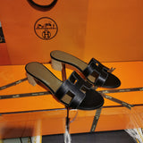 Hermès Black Ankle Strap Sandals - Angled View