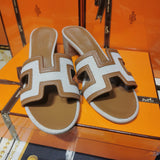 Hermès White Slide Sandals - Close-Up Texture View
