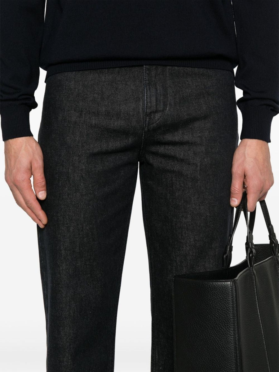 Close-up of Fendi pants hardware and fine stitching