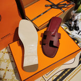 Hermès Grey Slide Sandals - Lifestyle Styling Shot
