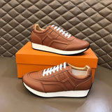 Hermès White High-Top Sneakers - Angled View