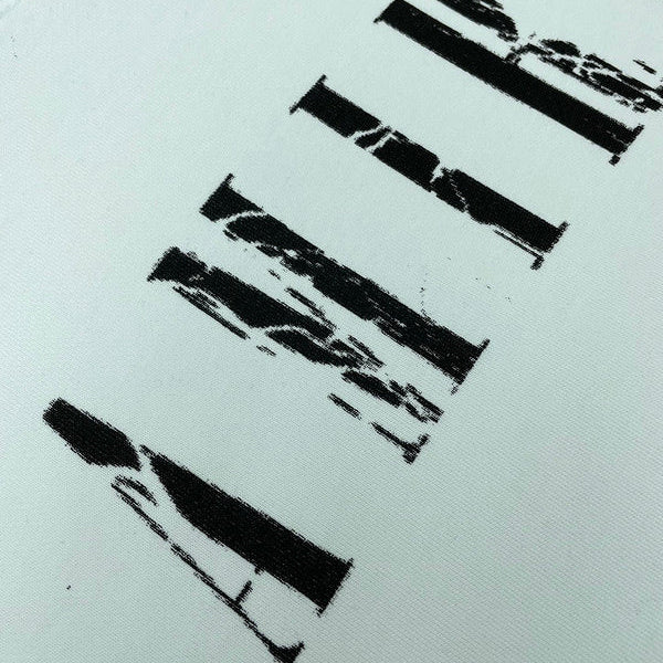Three-quarter angle view of Amiri luxury piece style No.107