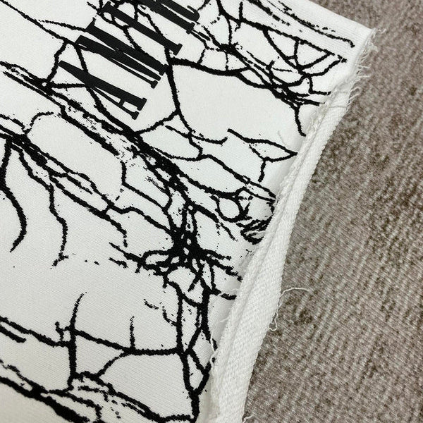 Three-quarter angle view of Amiri luxury piece style No.078